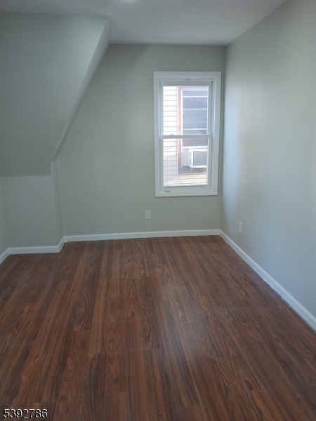 14 Ruth Street Irvington, NJ 07111 - Photo 10 of 15 an empty room with wooden floor and windows