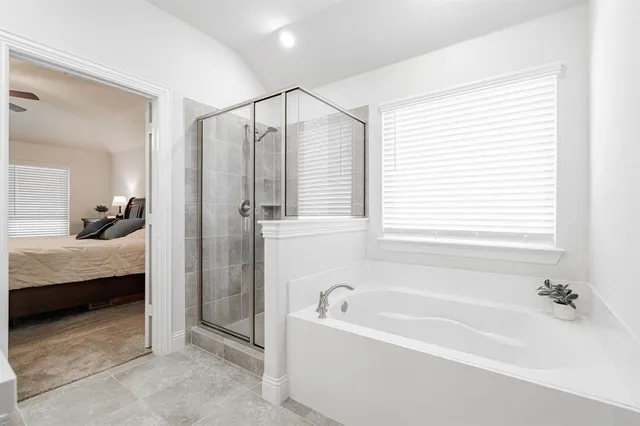 a bathroom with double sink and a mirror