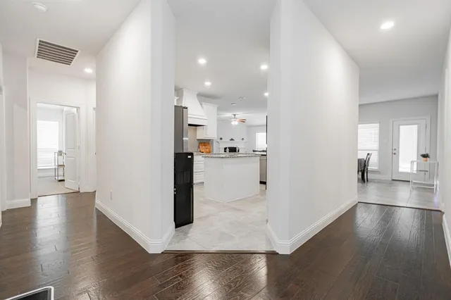 a view of a kitchen cabinets and wooden floor