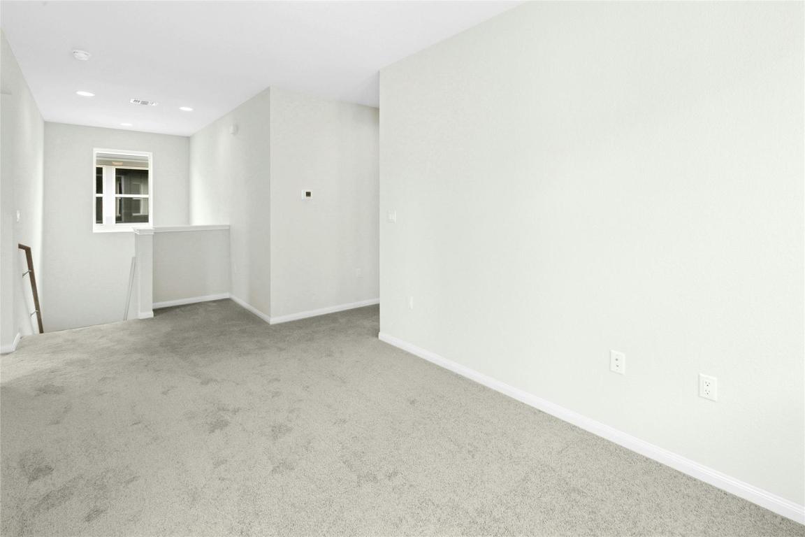 320 Creek Road, Unit 302 Dripping Springs, TX 78620 - Photo 5 of 21 Empty room with carpet floors and recessed lighting