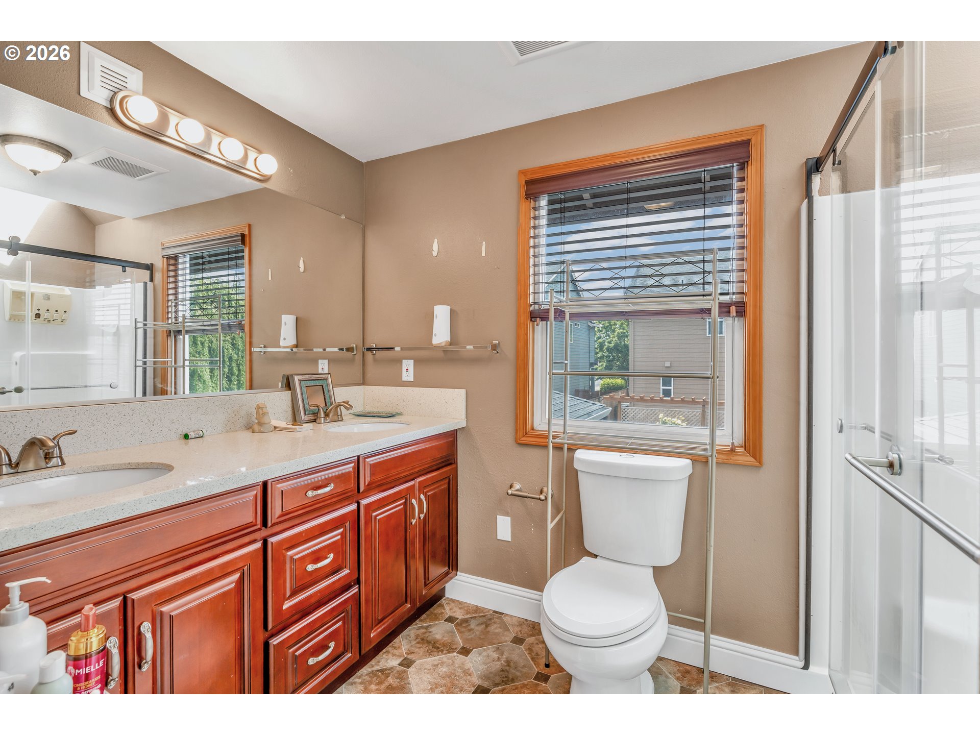 21498 Southwest Jay Street Beaverton, OR 97003 - Photo 35 of 47 a bathroom with a toilet sink and mirror