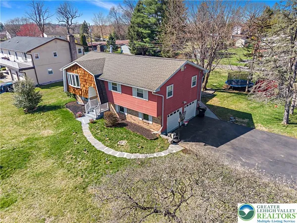 a aerial view of a house with garden