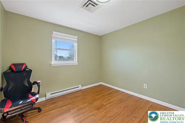 a workspace with furniture and wooden floor