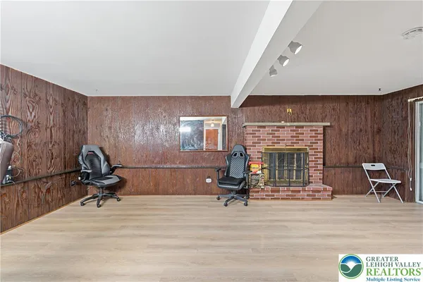a view of living room with furniture and floor to ceiling window