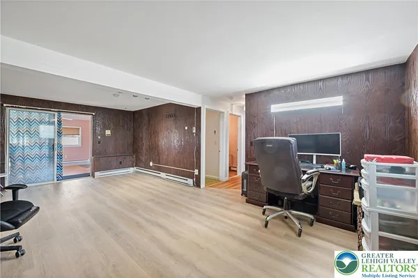 a workspace with furniture and a window