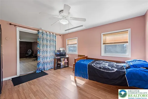 a bed room with a bed and a chandelier