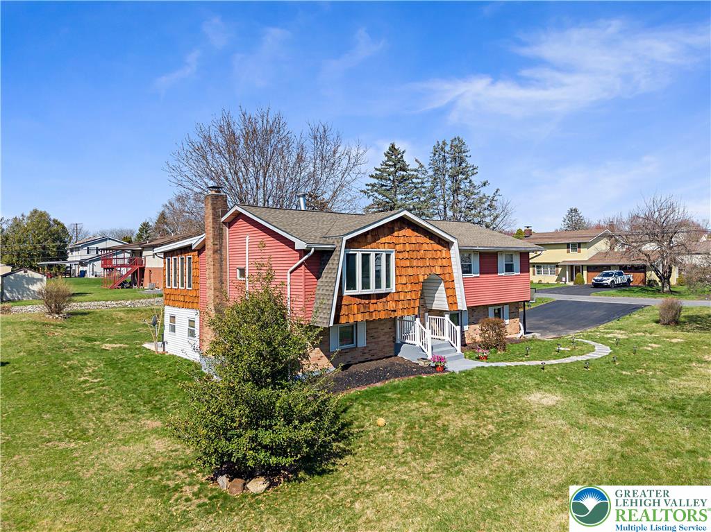 3945 Hemlock Place Bethlehem, PA 18017 - Photo 10 of 46 a front view of a house with garden