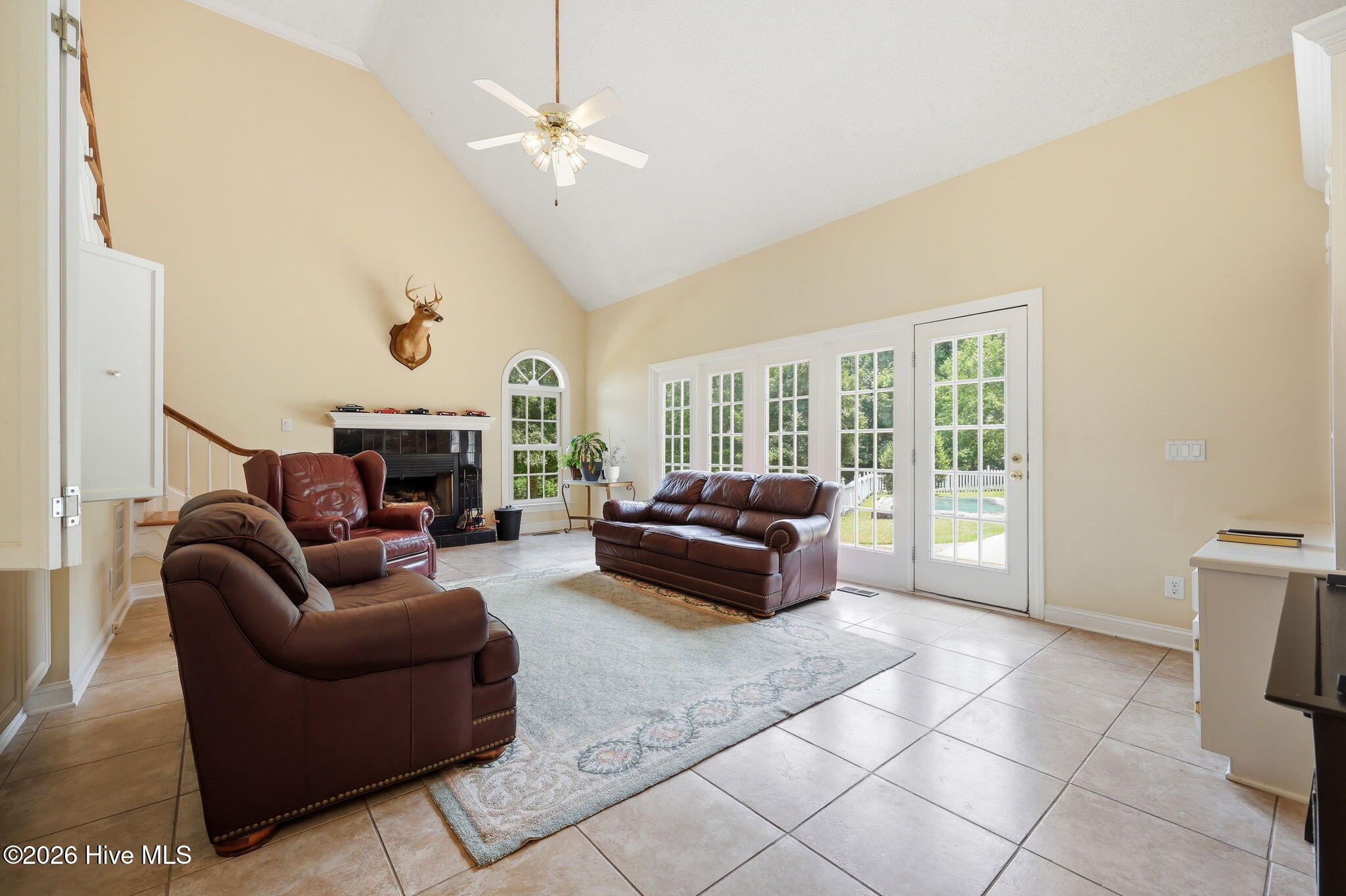 4076 Mobleys Bridge Road Grimesland, NC 27837 - Photo 15 of 66 two story vaulted living is of great scale, with plenty of nautural lighting and a wet bar that closes off for discretion
