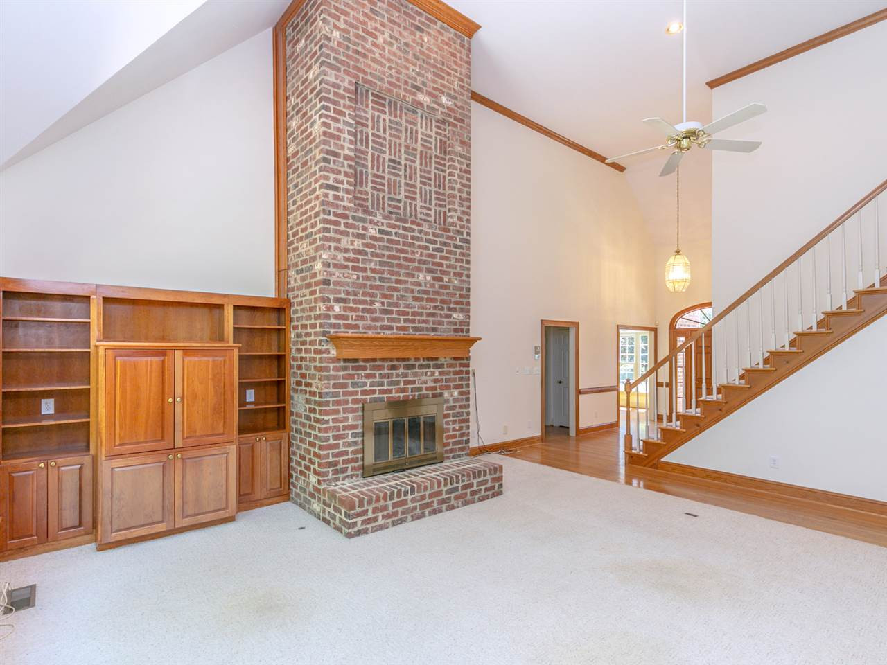 1609 Adams Mountain Road Raleigh, NC 27614 - Photo 8 of 29 Spacious and bright, the oversized family room has cathedral ceilings, built in cabinetry and is the perfect gathering spot. Family room