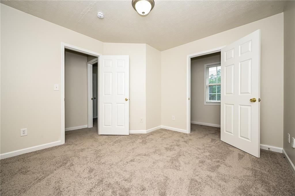 4468 Abram Way Conley, GA 30288 - Photo 13 of 23 an empty room with windows and closet