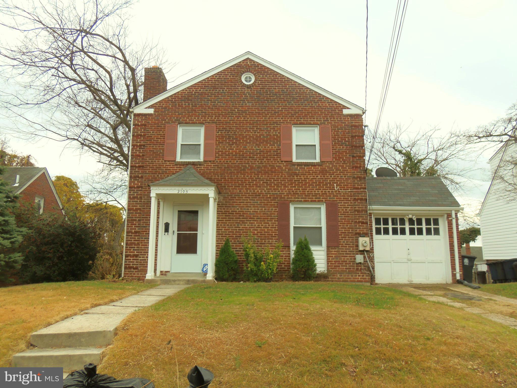2105 Brighton Road Hyattsville, MD 20782 - Photo 1 of 25 a front view of a house with a yard
