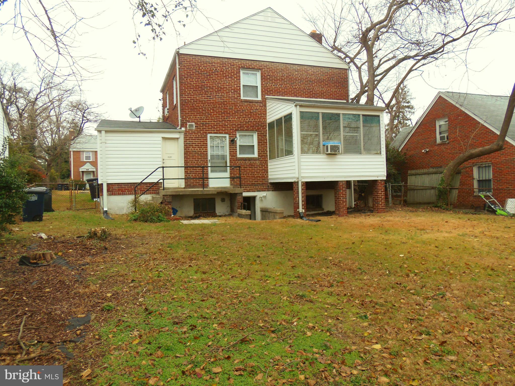 2105 Brighton Road Hyattsville, MD 20782 - Photo 21 of 25 a front view of a house with a yard