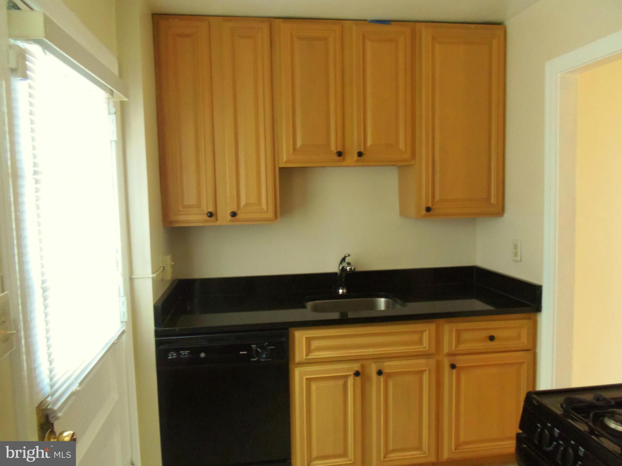 2105 Brighton Road Hyattsville, MD 20782 - Photo 10 of 25 a kitchen with a sink and cabinets