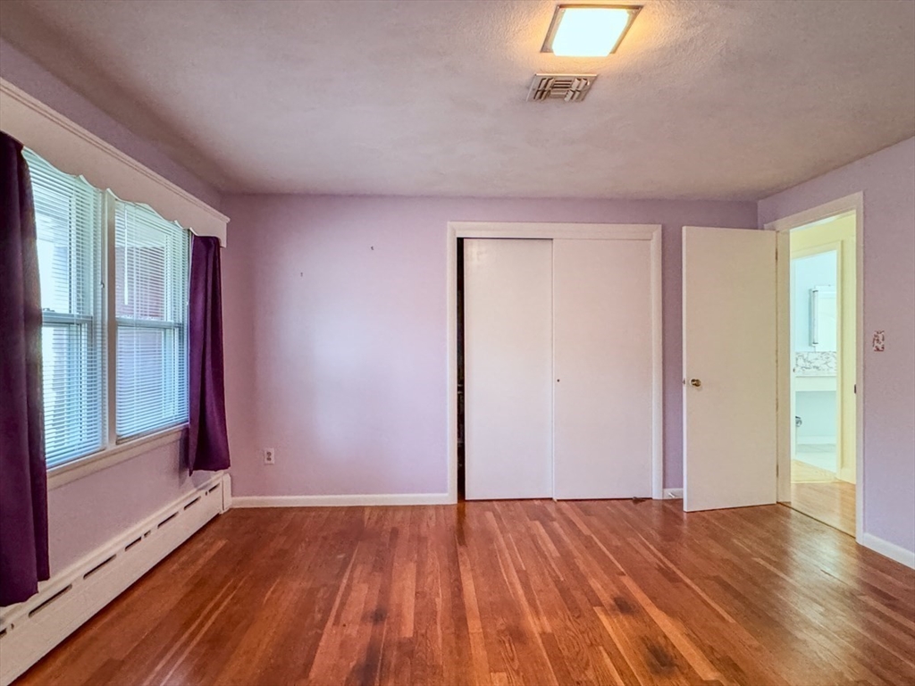 74 Petty Plain Road Greenfield, MA 01301 - Photo 13 of 42 an empty room with wooden floor and windows