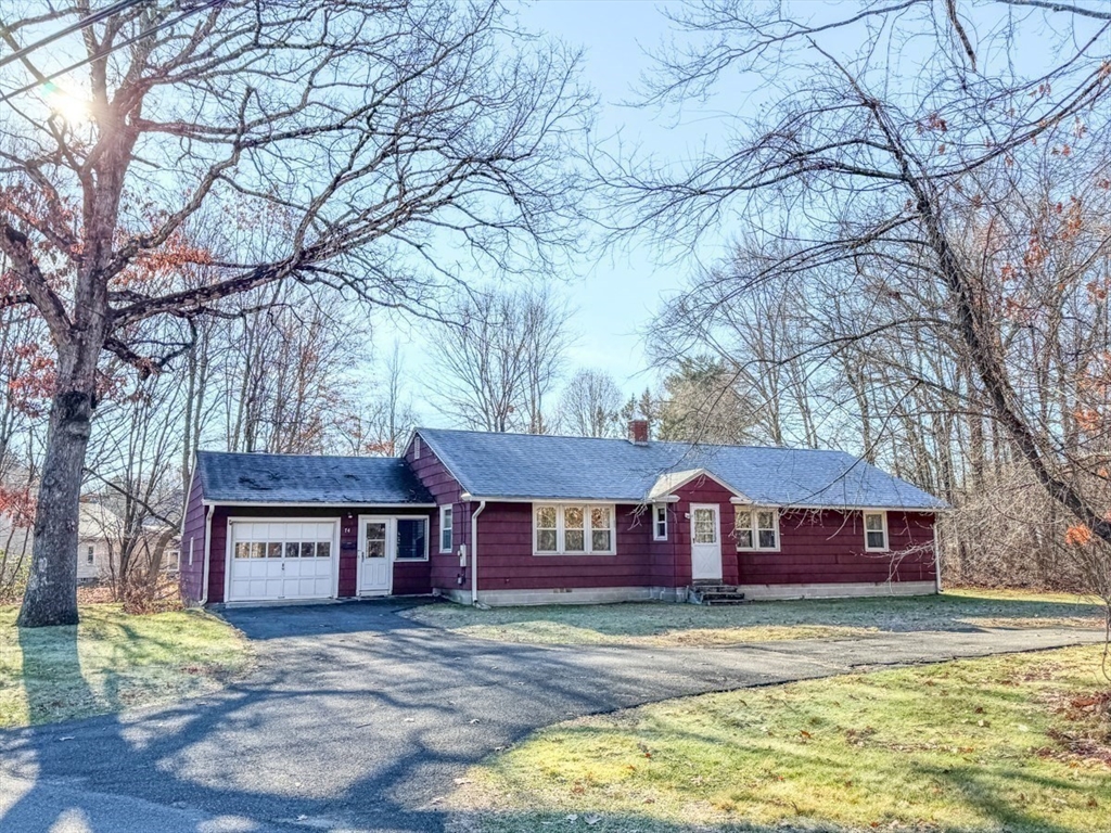 74 Petty Plain Road Greenfield, MA 01301 - Photo 42 of 42 a view of a big house with a big yard and large tree