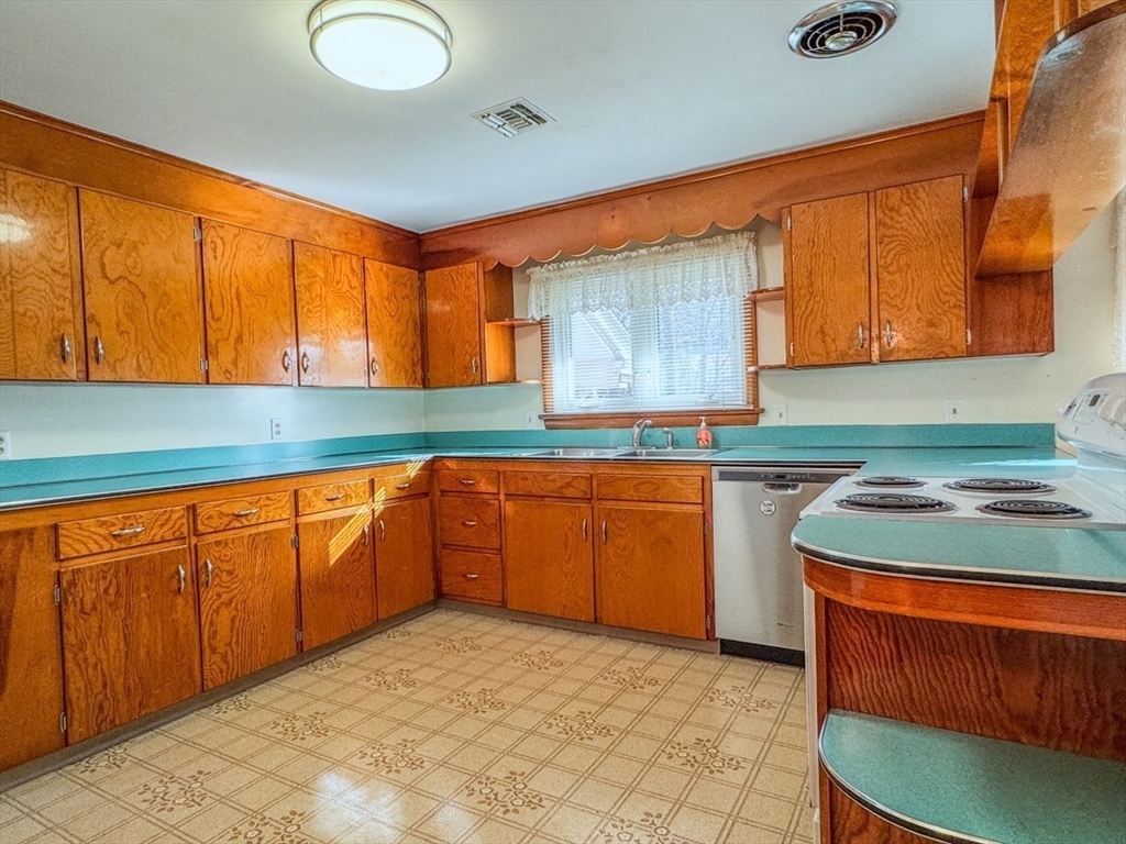 74 Petty Plain Road Greenfield, MA 01301 - Photo 8 of 42 a kitchen with granite countertop sink and cabinets