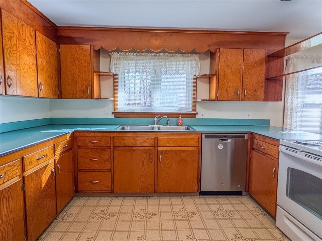 74 Petty Plain Road Greenfield, MA 01301 - Photo 9 of 42 a kitchen with granite countertop a sink and a cabinets