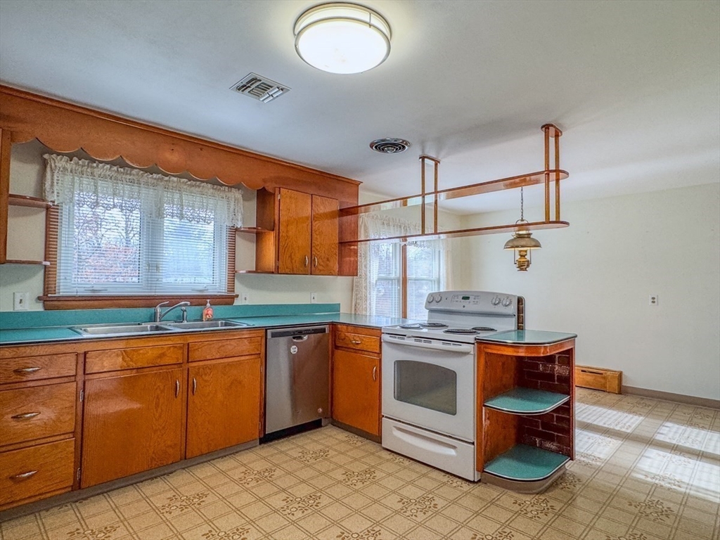 74 Petty Plain Road Greenfield, MA 01301 - Photo 10 of 42 a kitchen with stainless steel appliances granite countertop a sink and cabinets