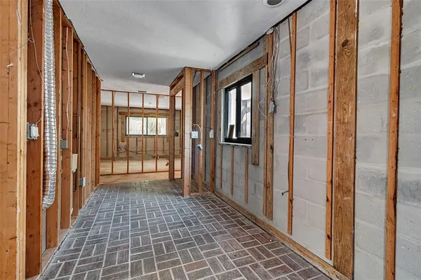 a view of empty room with windows