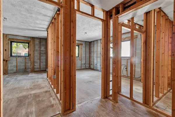 a view of a room with windows and stairs