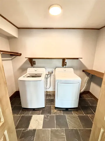 a white sink sitting next to a white toilet and a sink