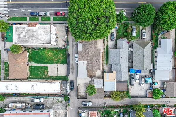 an aerial view of a houses with yard