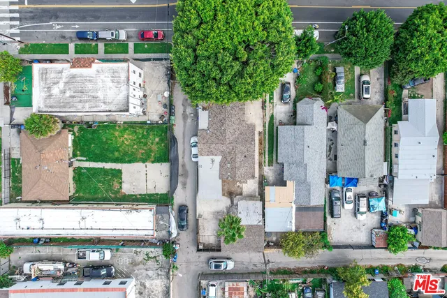 an aerial view of a houses with yard