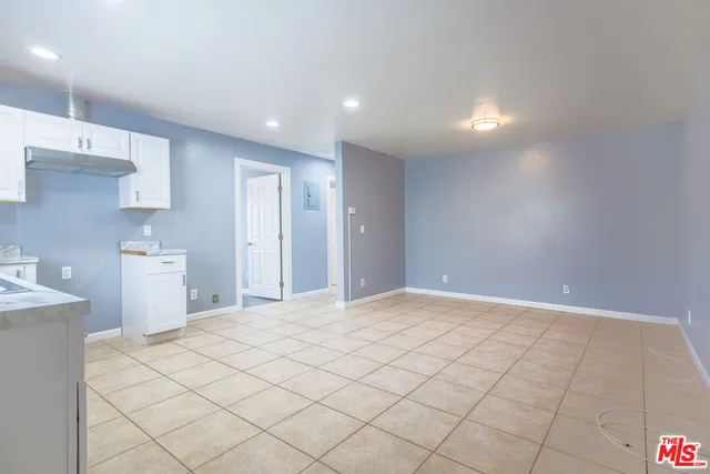 a view of a kitchen with marble kitchen