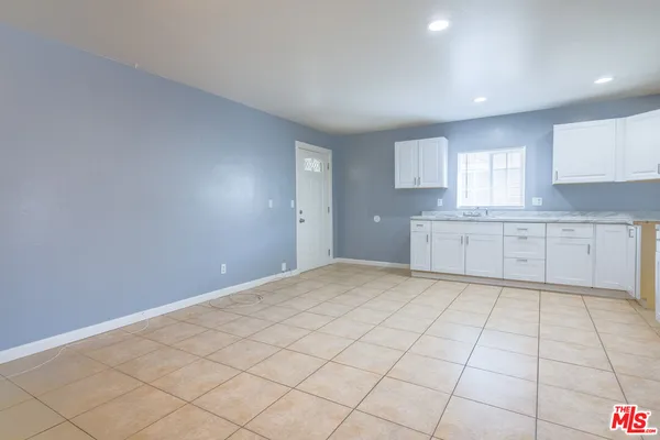a view of a kitchen with a sink and a cabinets