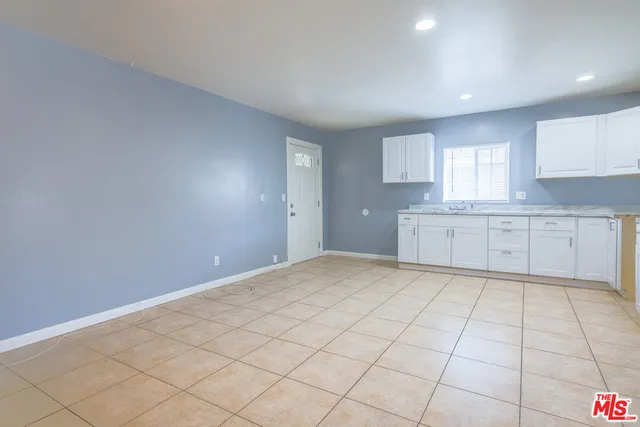 a view of a kitchen with a sink and a cabinets
