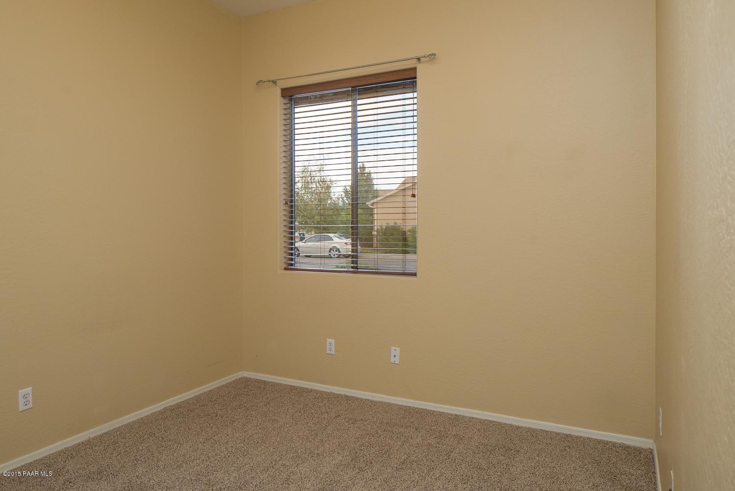 4752 Edgemont Road Prescott Valley, AZ 86314 - Photo 11 of 16 an empty room with windows