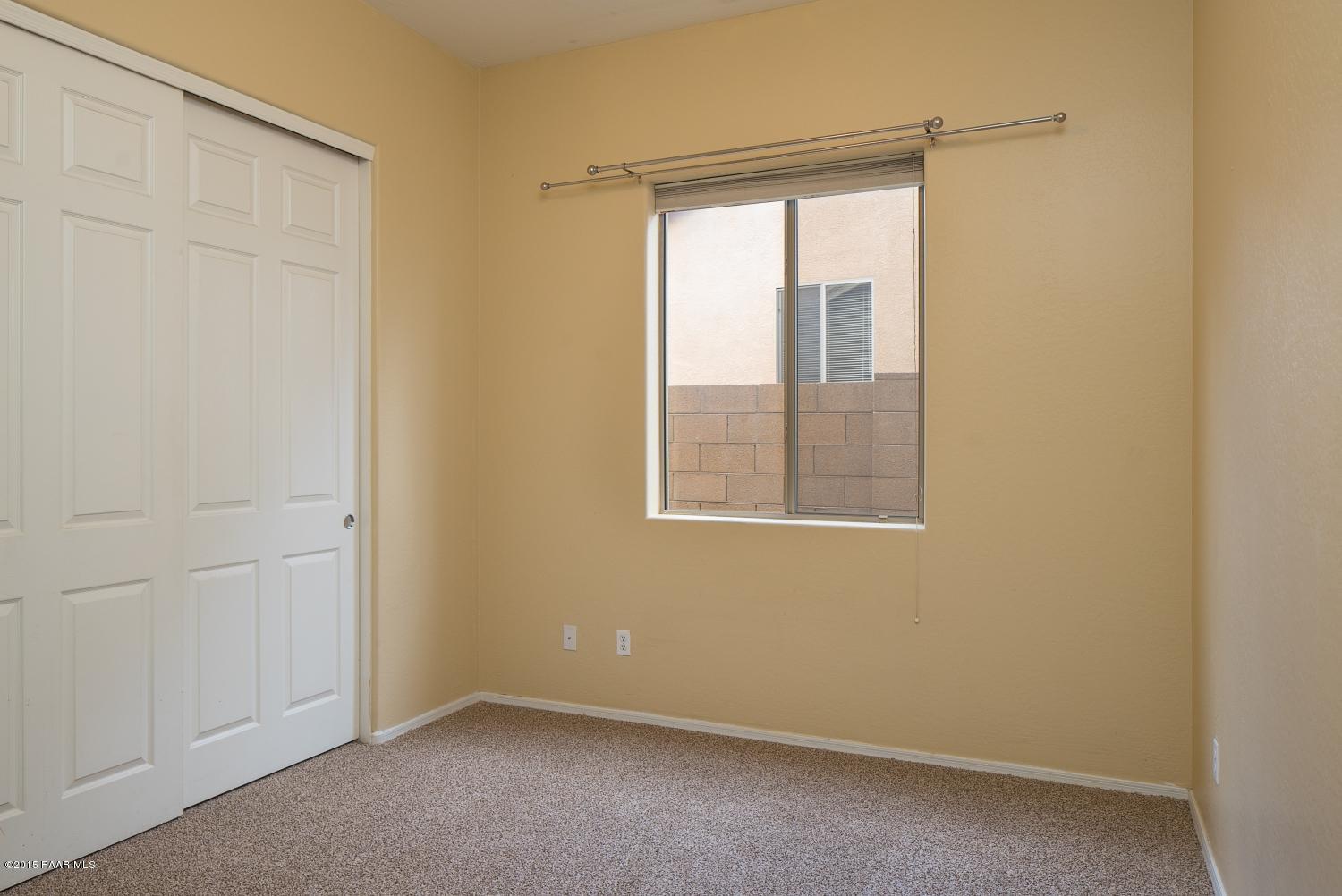 4752 Edgemont Road Prescott Valley, AZ 86314 - Photo 12 of 16 an empty room with a window