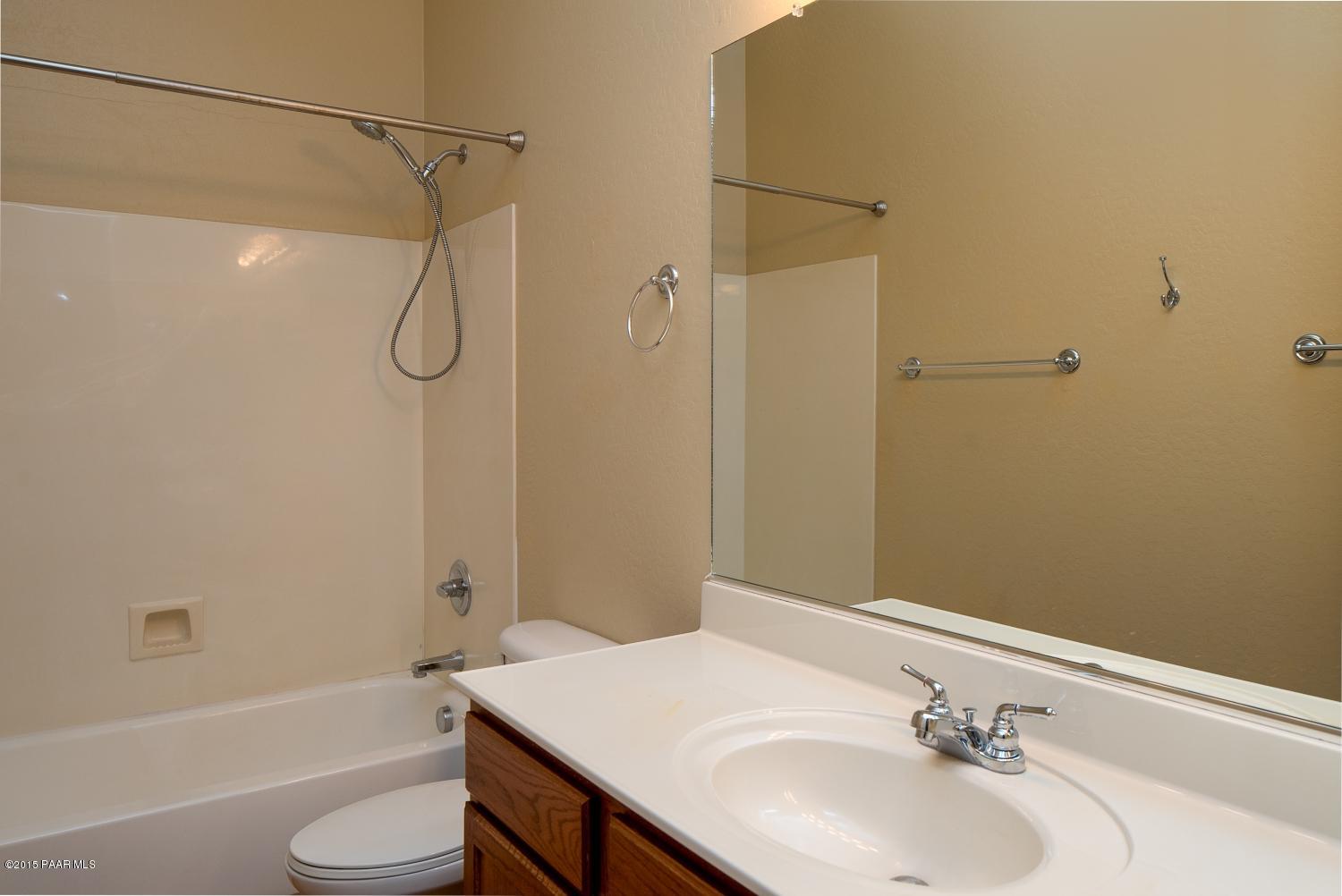 4752 Edgemont Road Prescott Valley, AZ 86314 - Photo 13 of 16 a bathroom with a sink a toilet and shower