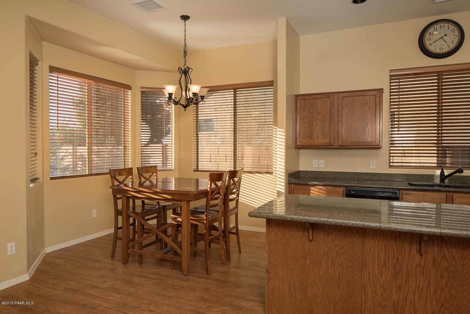 4752 Edgemont Road Prescott Valley, AZ 86314 - Photo 5 of 16 a view of a dining room with furniture and window