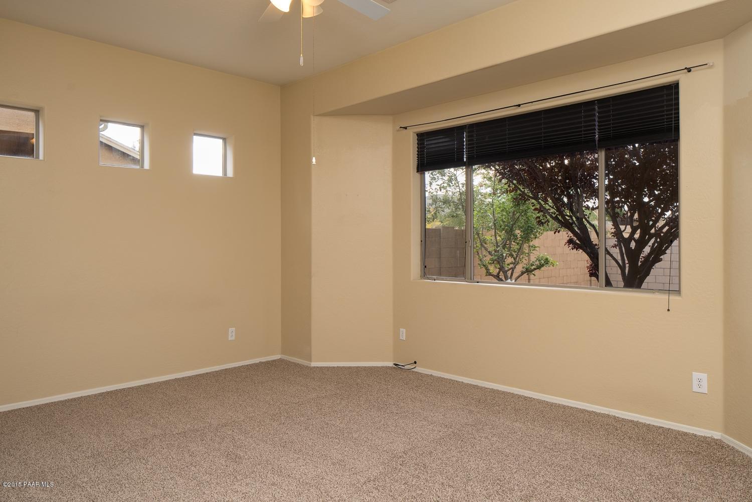4752 Edgemont Road Prescott Valley, AZ 86314 - Photo 9 of 16 an empty room with a window