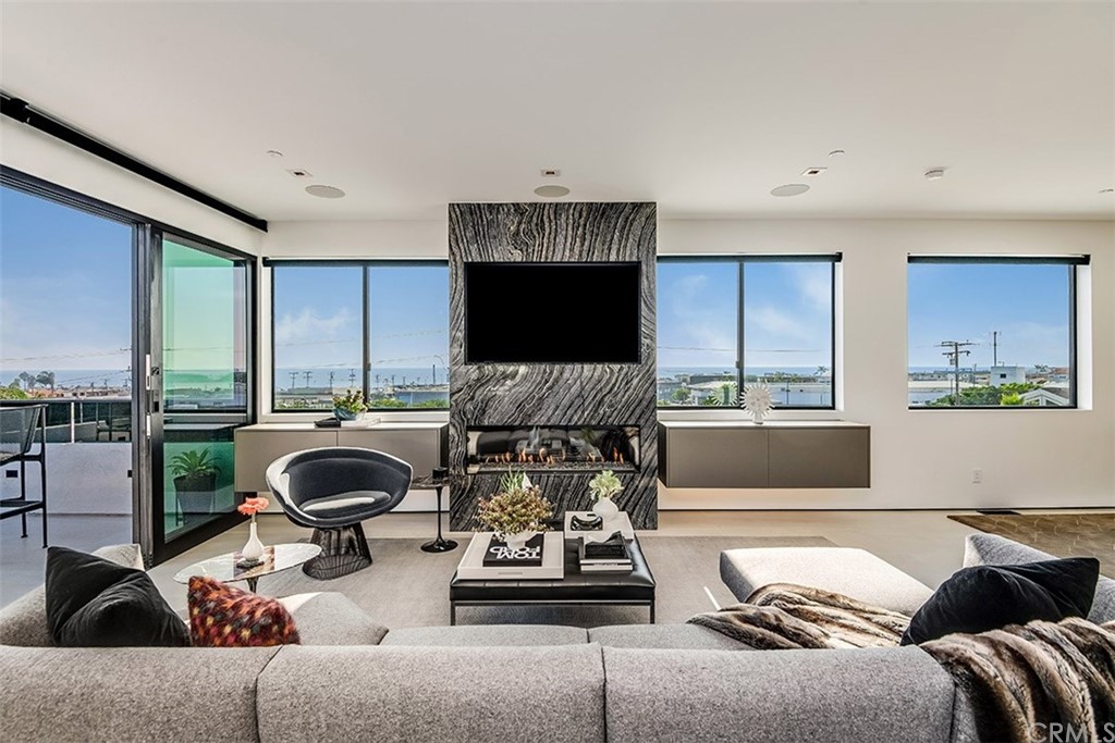 520 13th Street Manhattan Beach, CA 90266 - Photo 11 of 70 a living room with furniture and a large window