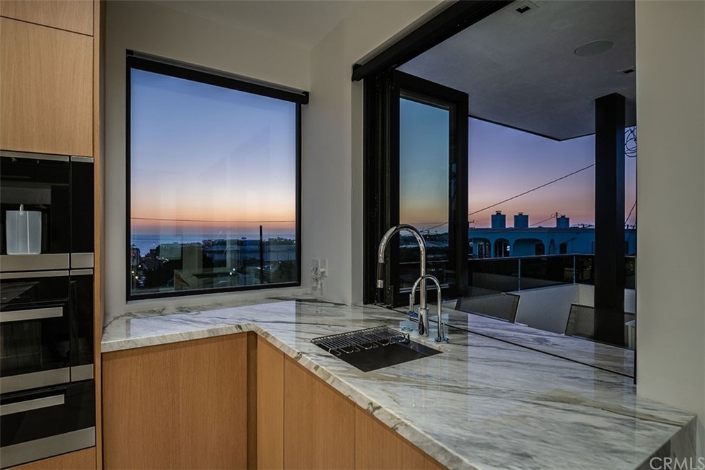 520 13th Street Manhattan Beach, CA 90266 - Photo 19 of 70 a kitchen with a sink and a large window