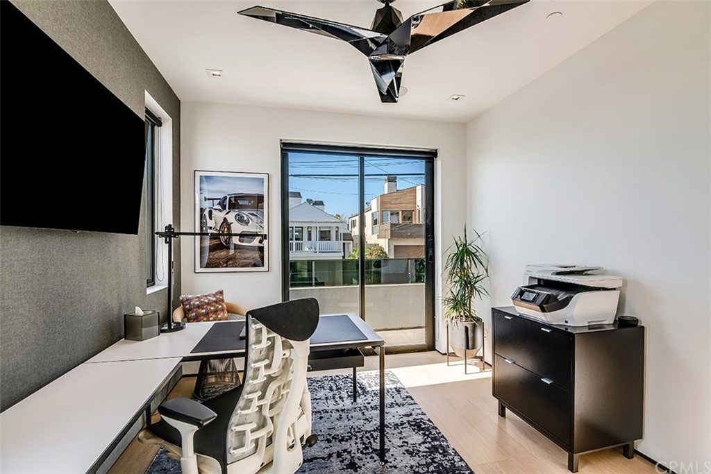 520 13th Street Manhattan Beach, CA 90266 - Photo 26 of 70 a living room with furniture and a flat screen tv