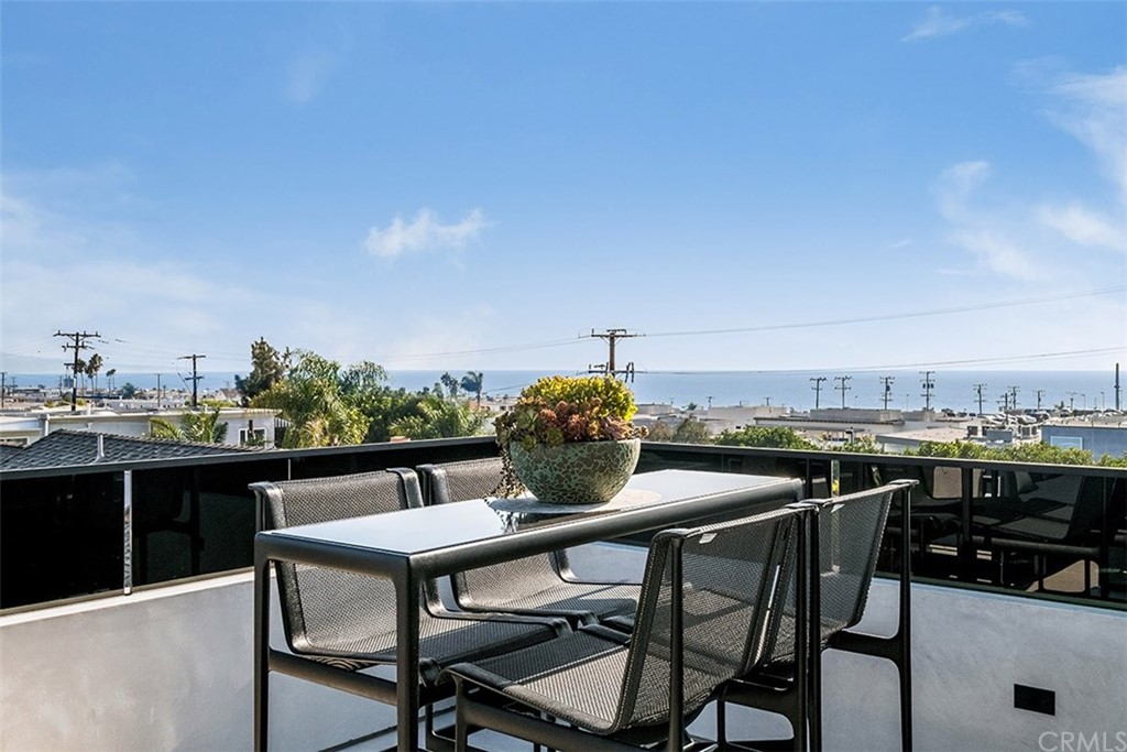 520 13th Street Manhattan Beach, CA 90266 - Photo 30 of 70 a view of a chairs and table on the terrace