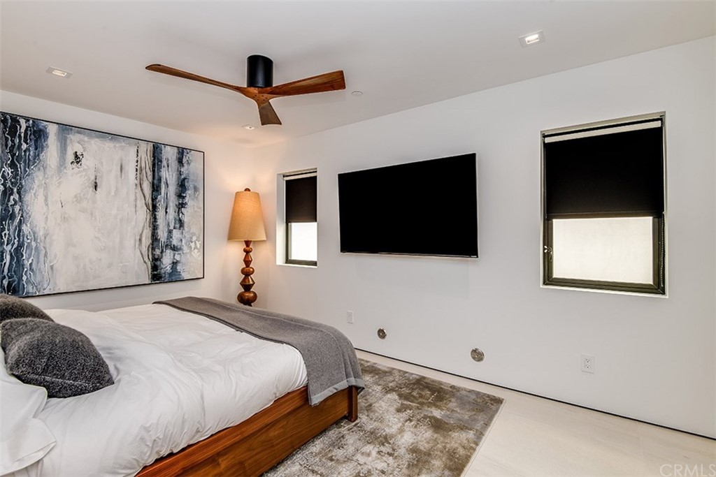 520 13th Street Manhattan Beach, CA 90266 - Photo 37 of 70 a bedroom with a bed and a flat screen tv