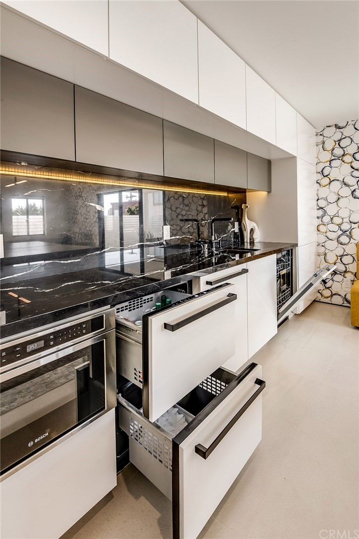 520 13th Street Manhattan Beach, CA 90266 - Photo 44 of 70 a kitchen with granite countertop a stove and a sink
