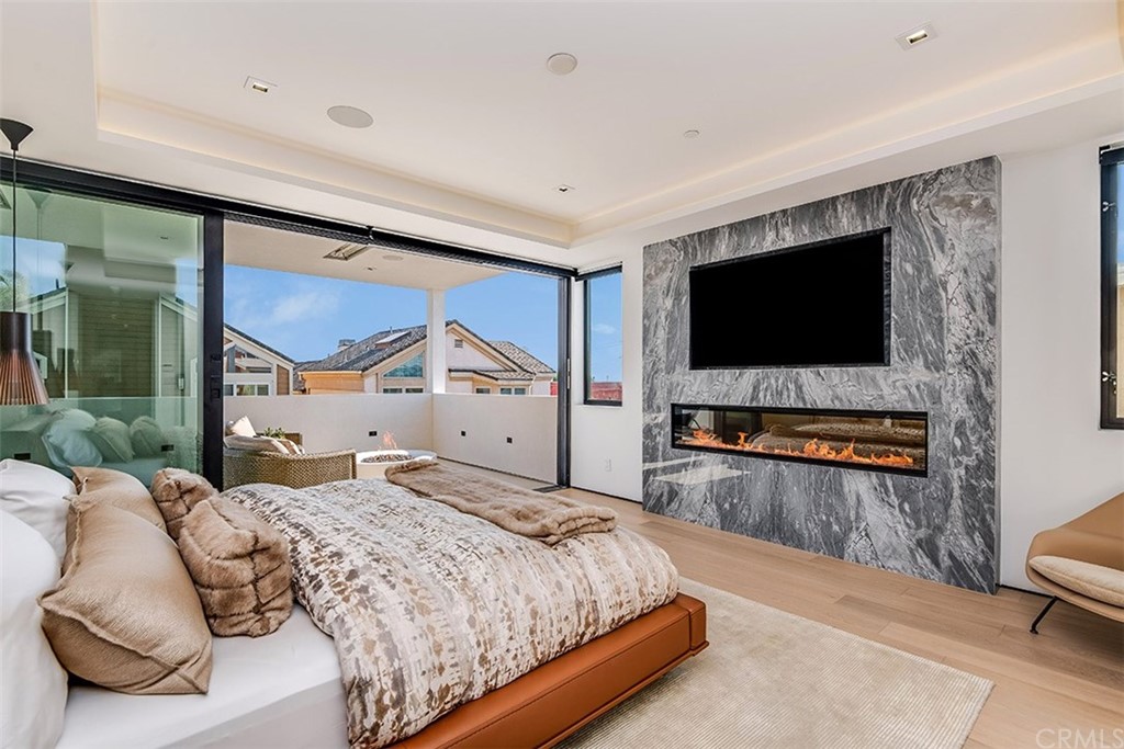 520 13th Street Manhattan Beach, CA 90266 - Photo 47 of 70 a bedroom with a bed and a flat screen tv