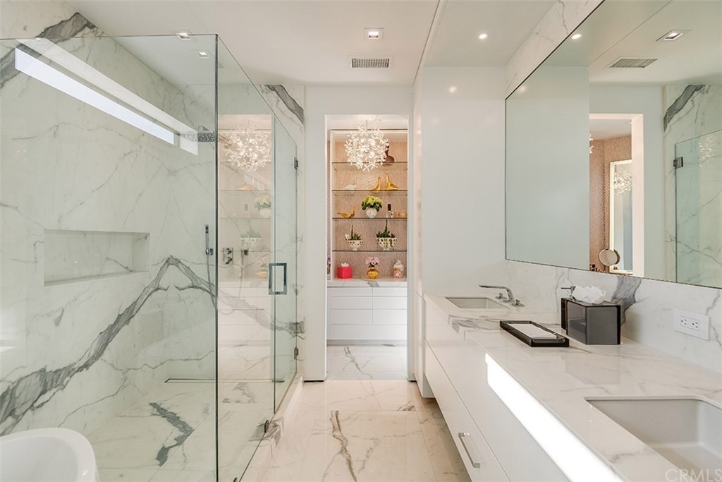 520 13th Street Manhattan Beach, CA 90266 - Photo 52 of 70 a bathroom with a granite countertop sink a mirror and shower