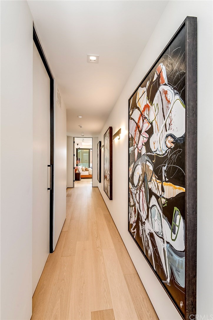 520 13th Street Manhattan Beach, CA 90266 - Photo 62 of 70 a view of a hallway with wooden floor and a potted plant