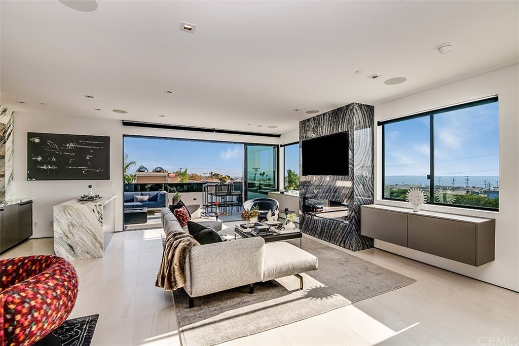 520 13th Street Manhattan Beach, CA 90266 - Photo 7 of 70 a living room with fireplace furniture and a flat screen tv