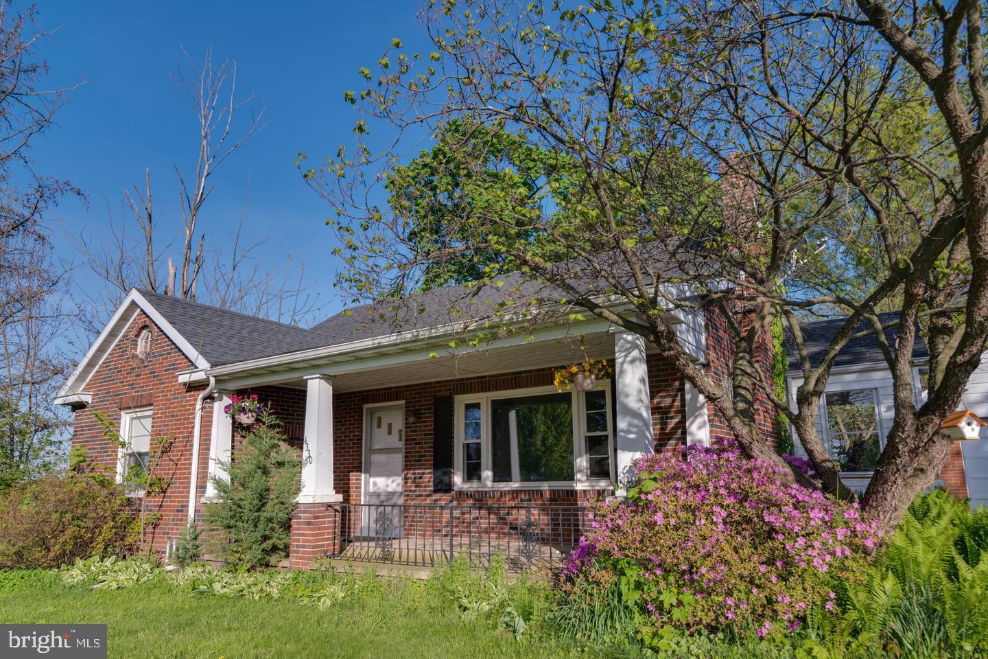 4330 Paradise Road Dover, PA 17315 - Photo 27 of 33 Charming brick home with vibrant blooms.