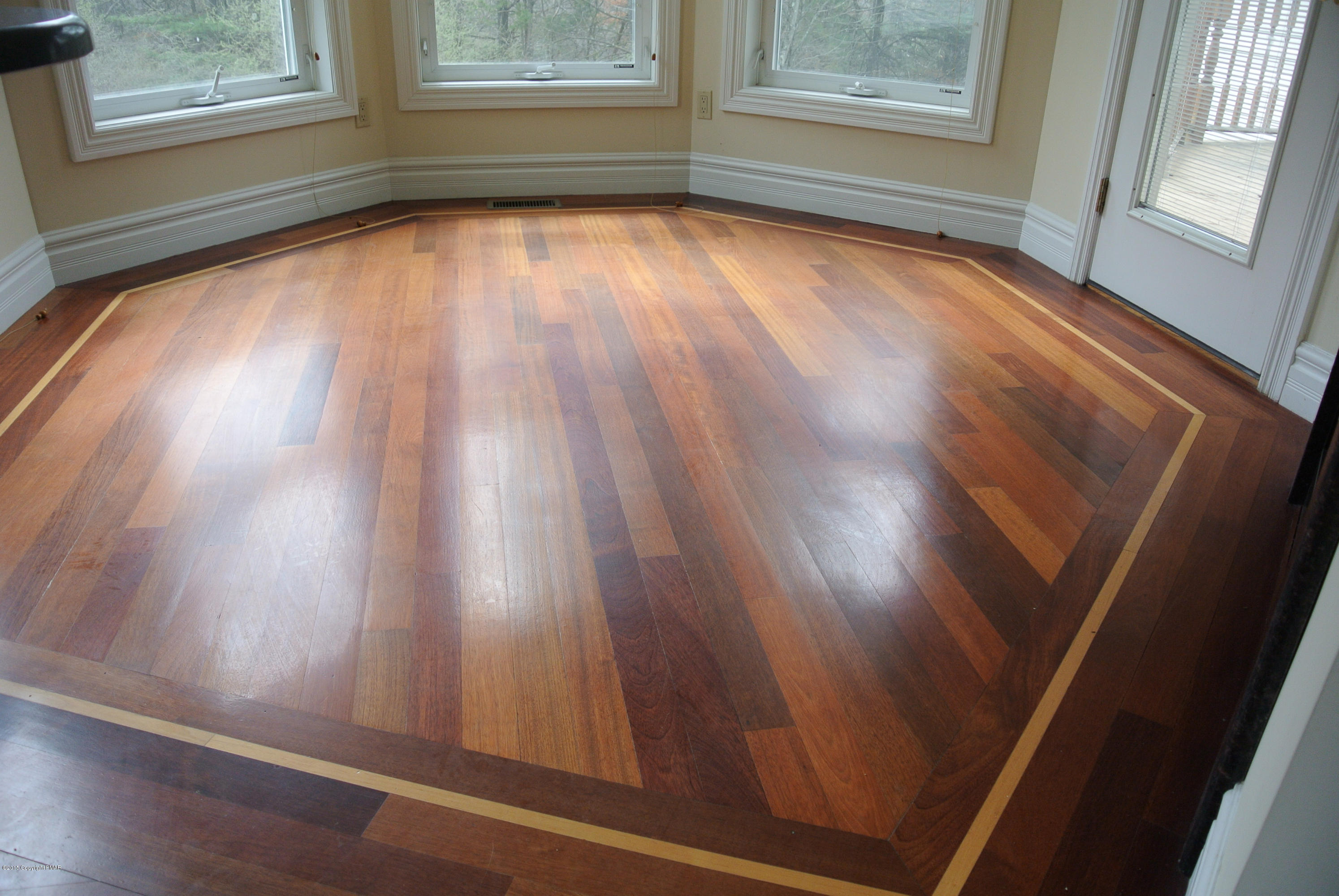 542 Quail Ridge Lane Stroudsburg, PA 18360 - Photo 5 of 12 a view of an empty room with wooden floor and a window