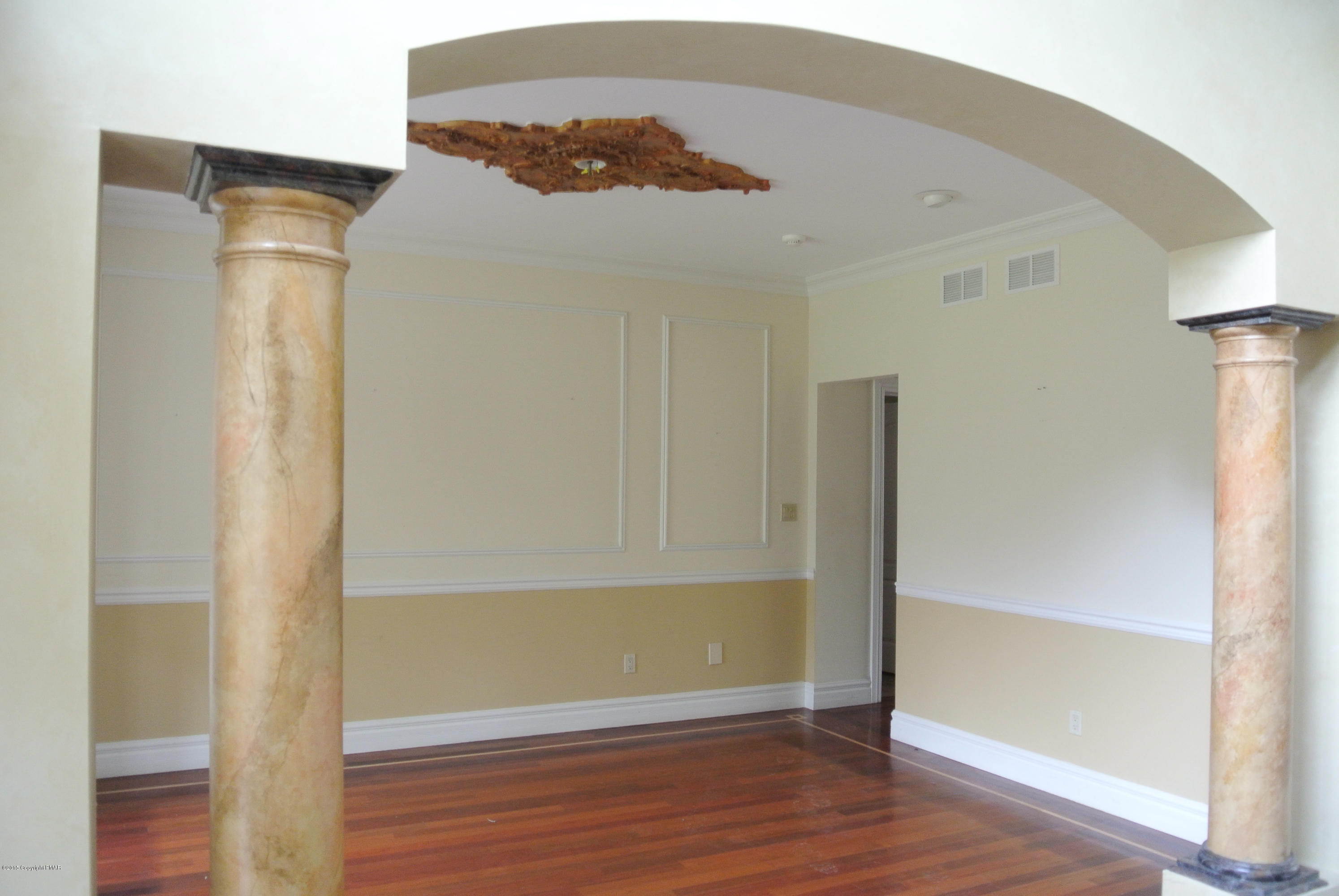 542 Quail Ridge Lane Stroudsburg, PA 18360 - Photo 6 of 12 a view of an empty room with wooden floor and a window