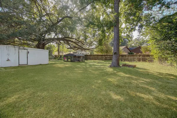 a backyard of a house with lots of green space