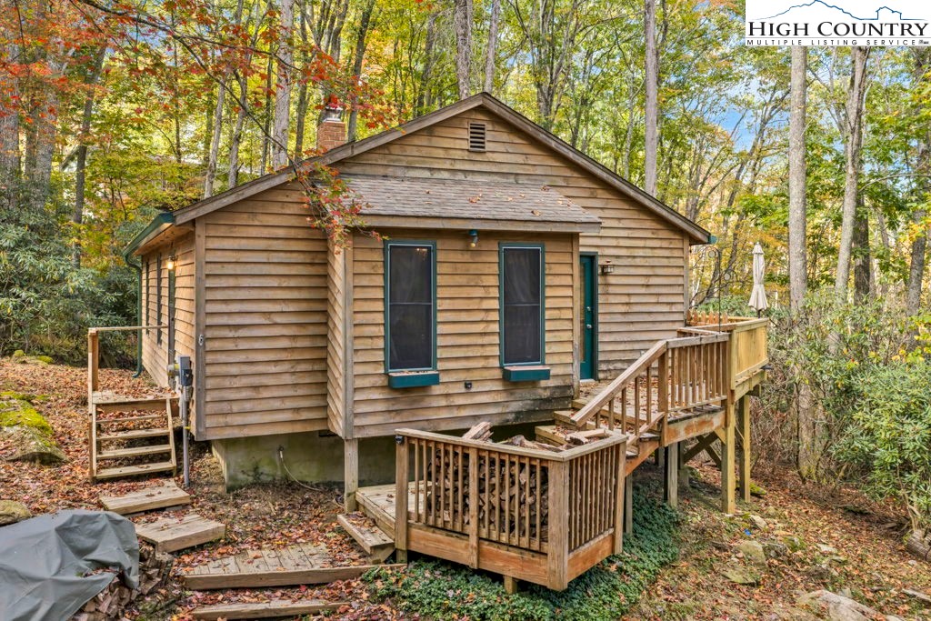180 Wild Blackberry Hill Road Boone, NC 28607 - Photo 2 of 30 front view of a house with a yard